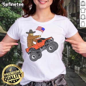 Awesome Bigfoot USA Flag Monster Truck metallic star ornament on ladies tee, perfect for truck lovers and outdoor enthusiasts.