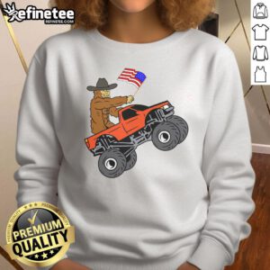 Awesome Bigfoot USA Flag Monster Truck metallic star ornament sweatshirt featuring bold graphic design and vibrant colors.