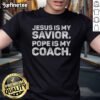 Good Jesus Is My Savior Pope Is My Coach T-Shirt featuring a religious quote design in bold lettering.