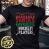 Santa's Favorite Ice Hockey Player Christmas Ornament T-Shirt featuring festive graphics and holiday spirit.
