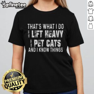 Funny I Lift Heavy Pet Cats And Know Things Ladies Tee showcasing a playful cat graphic and humorous text design.