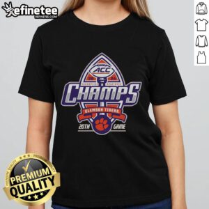 Alt Text: Official Clemson Tigers Blue 84 2024 ACC Football Conference Champions ladies tee displayed in a locker room setting.