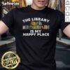 Happy bookworm librarian wearing a 'Happy The Library' T-shirt, showcasing love for books and reading culture.