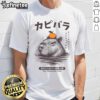 Alt Text: Capybara relaxing in an onsen, wearing an orange 'Capybara Lovers' T-shirt, showcasing a tranquil scene.