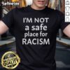 Alt Text: Official I'm Not A Safe Place For Racism T-Shirt featuring bold text on a black background, promoting anti-racism.