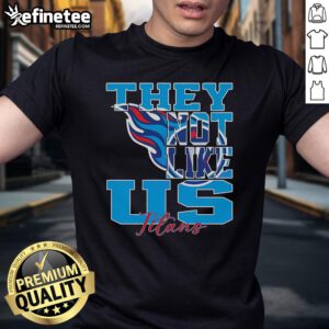 Official They Not Like Us Tennessee Titans NFL Football 2025 T-Shirt featuring team colors and logo for fans.