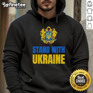 Protesters wearing 'Stand With Ukraine' hoodies at a rally against Russia and Trump, showcasing solidarity and activism.