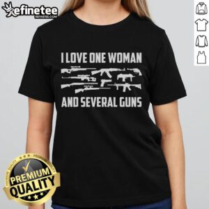 Confident woman showcasing several guns, wearing a Pro 2A Ladies Tee, perfect for gun lovers and enthusiasts.