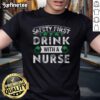 Premium Safety First With A Nurse Gift St Patrick's Day T-Shirt featuring a festive design for nurses celebrating the holiday.