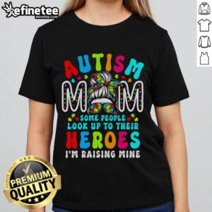 Groovy messy bun mom wearing a tee for Autism Awareness, celebrating top autism moms and raising awareness.