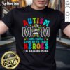 Top Autism Mom Raising Hero T-Shirt featuring a groovy messy bun design for Autism Awareness.