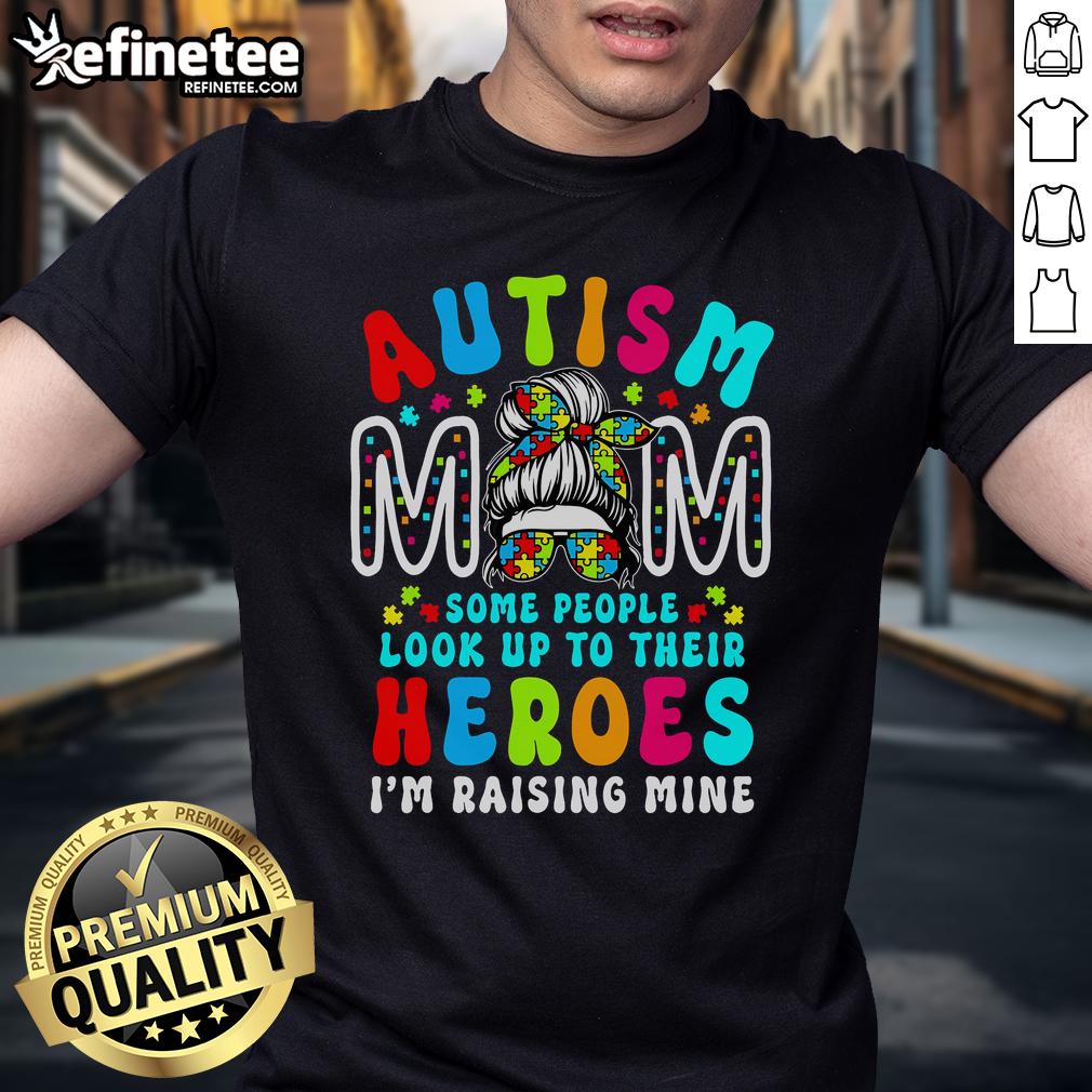 Top Autism Mom Raising Hero T-Shirt featuring a groovy messy bun design for Autism Awareness.
