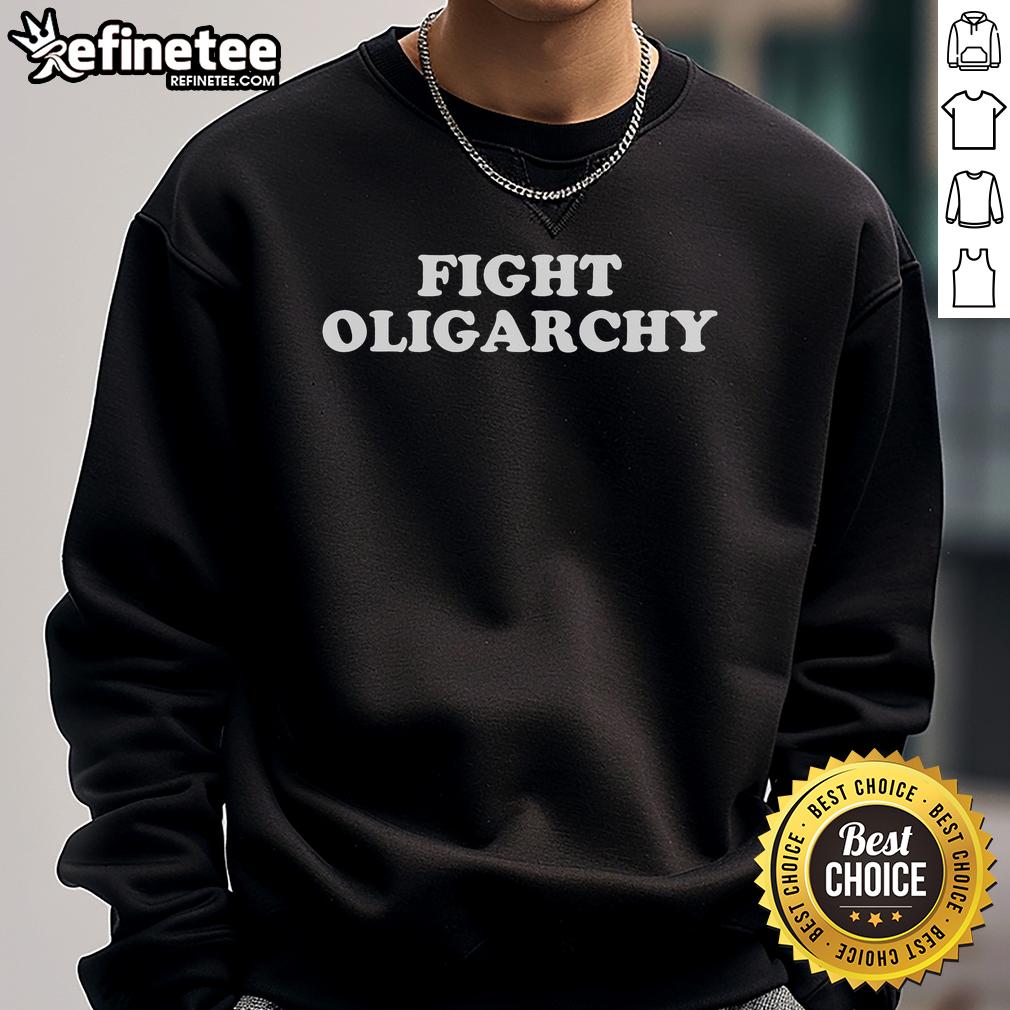 Activist wearing a 'Hot Fight Oligarchy' sweatshirt, standing in protest against corporate greed.