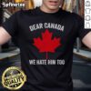 Hot Maple Leaf 'Dear Canada, We Hate Him Too' T-Shirt featuring bold text and a Canadian flag design.