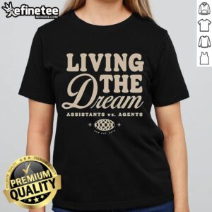 Women in 'Nice Assistants Vs Agents Living The Dream' tee, showcasing style and empowerment in vibrant colors.