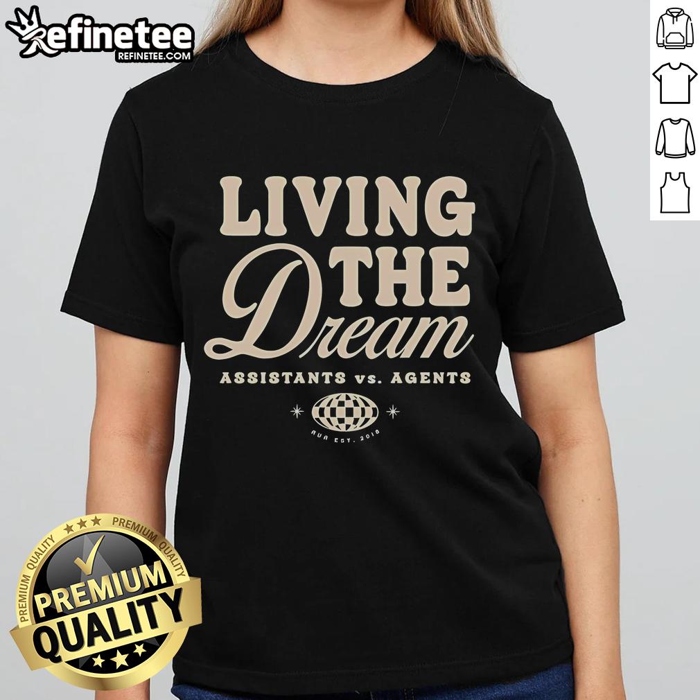 Women in 'Nice Assistants Vs Agents Living The Dream' tee, showcasing style and empowerment in vibrant colors.