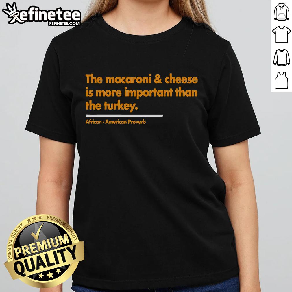 Womens tee featuring 'Nice Mac Cheese Is More Important Than Turkey' design, perfect for Thanksgiving celebrations.