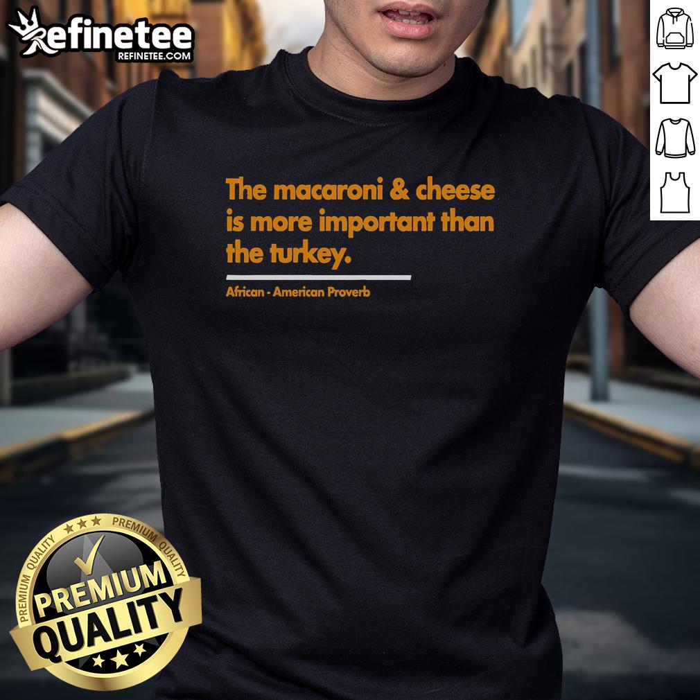Funny Thanksgiving T-Shirt featuring 'Nice Mac & Cheese Is More Important Than Turkey' slogan for festive celebrations.