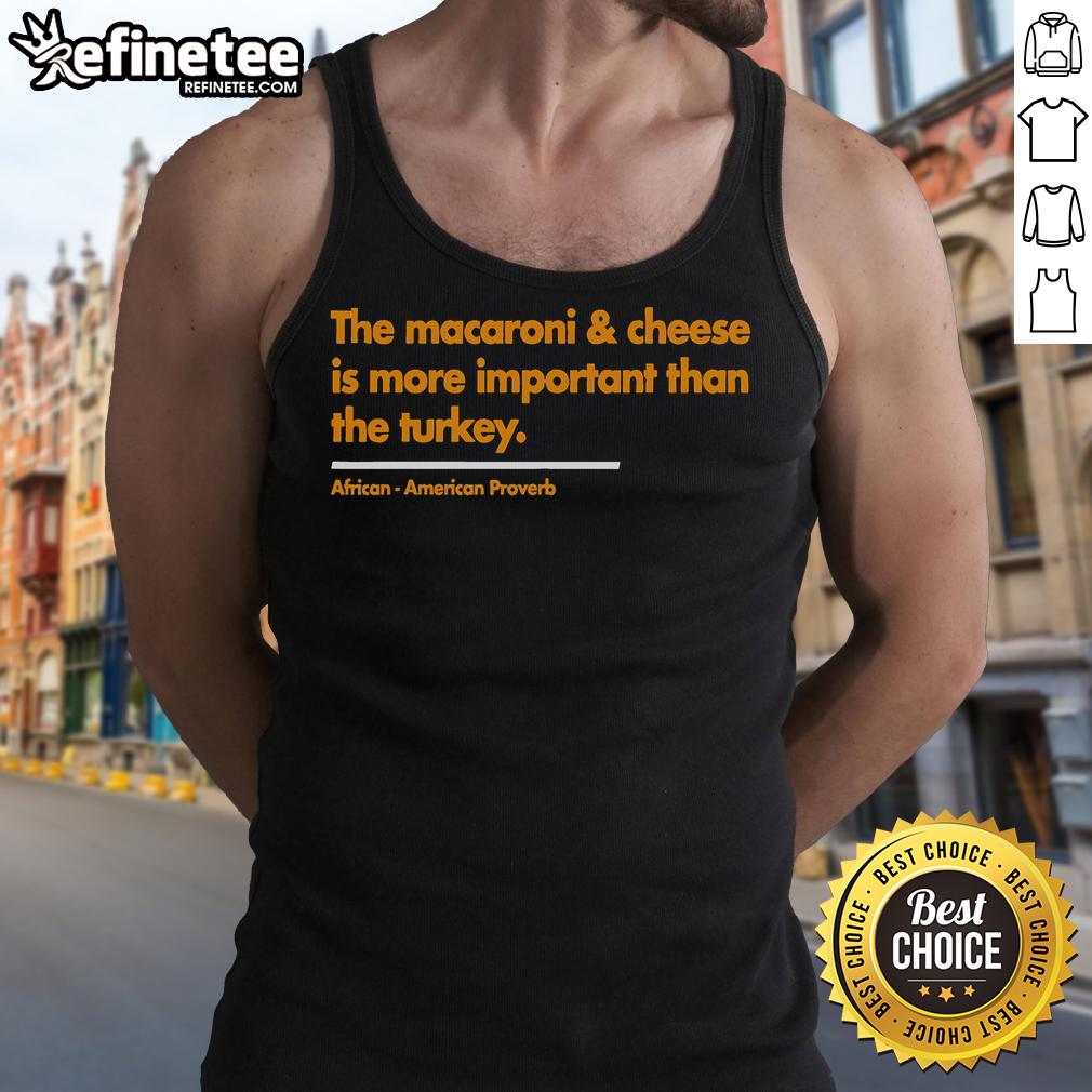 Funny Thanksgiving tank top featuring 'Mac Cheese is More Important Than Turkey' design for holiday celebrations.