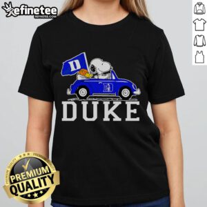 Snoopy and Woodstock driving in a car, featuring a Duke Blue Devils basketball ladies tee design.