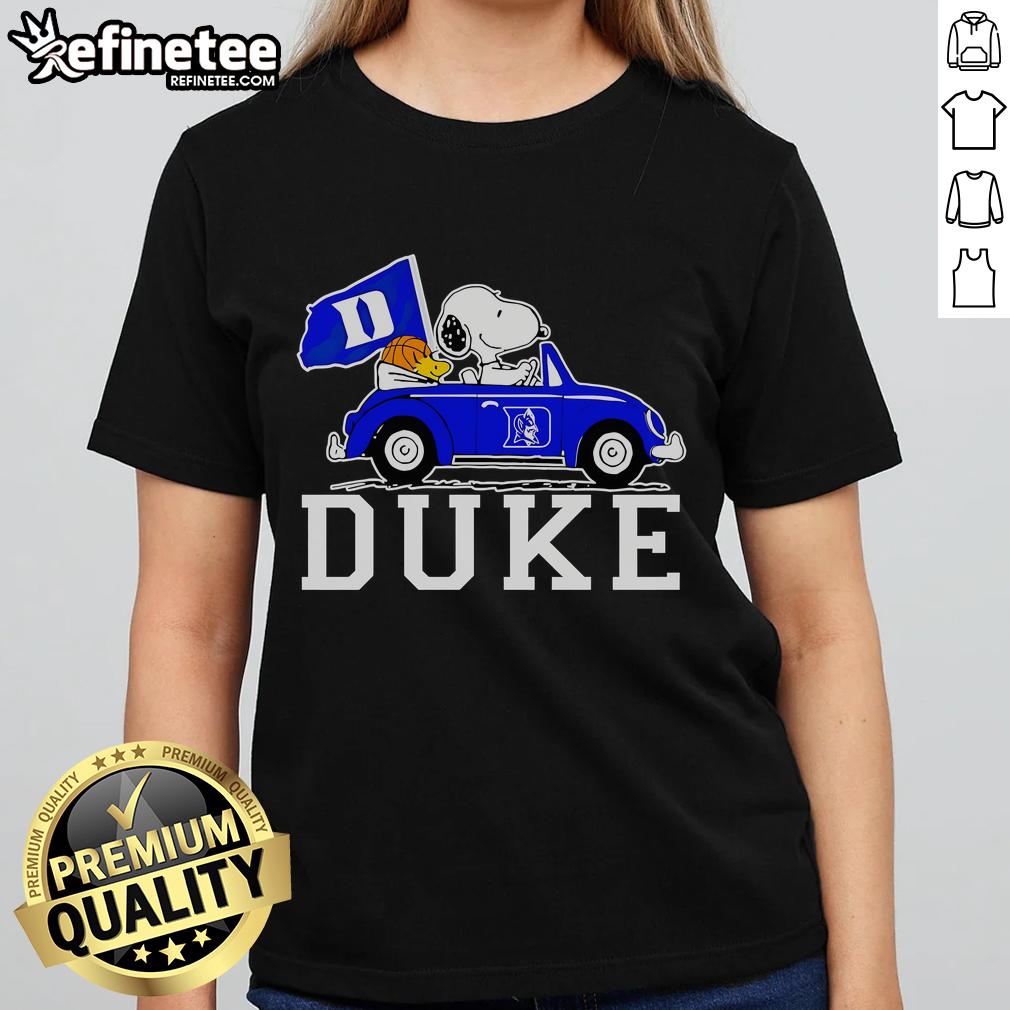 Snoopy and Woodstock driving in a car, featuring a Duke Blue Devils basketball ladies tee design.