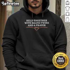 Alt Text: Cozy Held Together With Baling Twine And A Prayer hoodie, perfect for casual wear and expressing rustic charm.