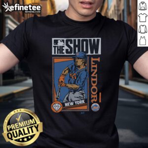 Alt Text: Official MLB The Show Mets Francisco Lindor T-Shirt featuring vibrant team colors and player graphics. Perfect for fans!
