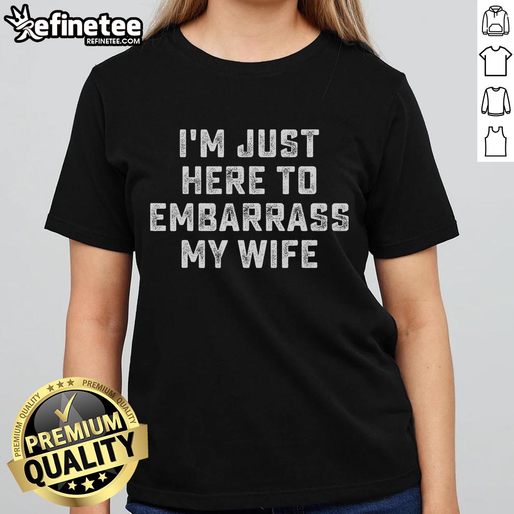 Funny 'I'm Just Here to Embarrass My Wife' tee for husbands, perfect for playful couples and humorous gifts.
