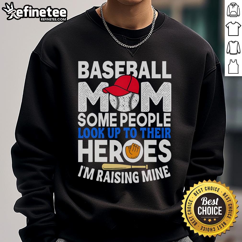 Funny baseball mom sweatshirt with 'Some people look up to their heroes, I'm raising mine' slogan for proud moms.