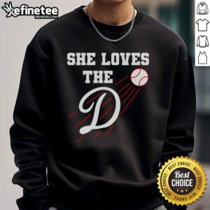 Woman wearing a Nice Baseball sweatshirt, 'She Loves The D' design, showcasing Los Angeles style and comfort.