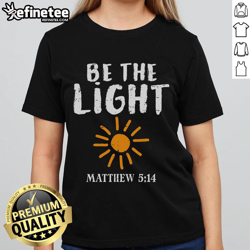 Christian ladies tee featuring 'Be The Light' design inspired by Matthew 5:14, perfect for faith-filled fashion.