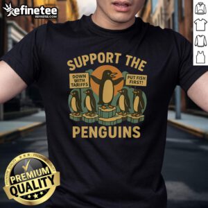 Marching penguins design on a retro t-shirt promoting economic freedom and resistance against tariffs.