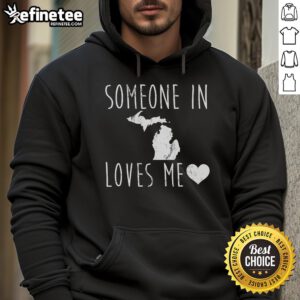 Cozy 'Someone In Michigan State Loves Me' hoodie displayed on a hanger, perfect for showing Michigan State pride.