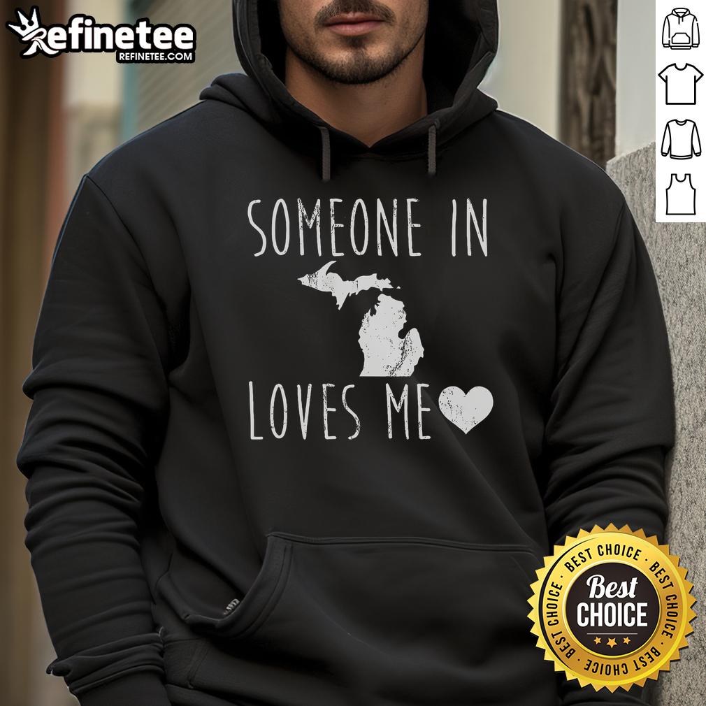 Cozy 'Someone In Michigan State Loves Me' hoodie displayed on a hanger, perfect for showing Michigan State pride.