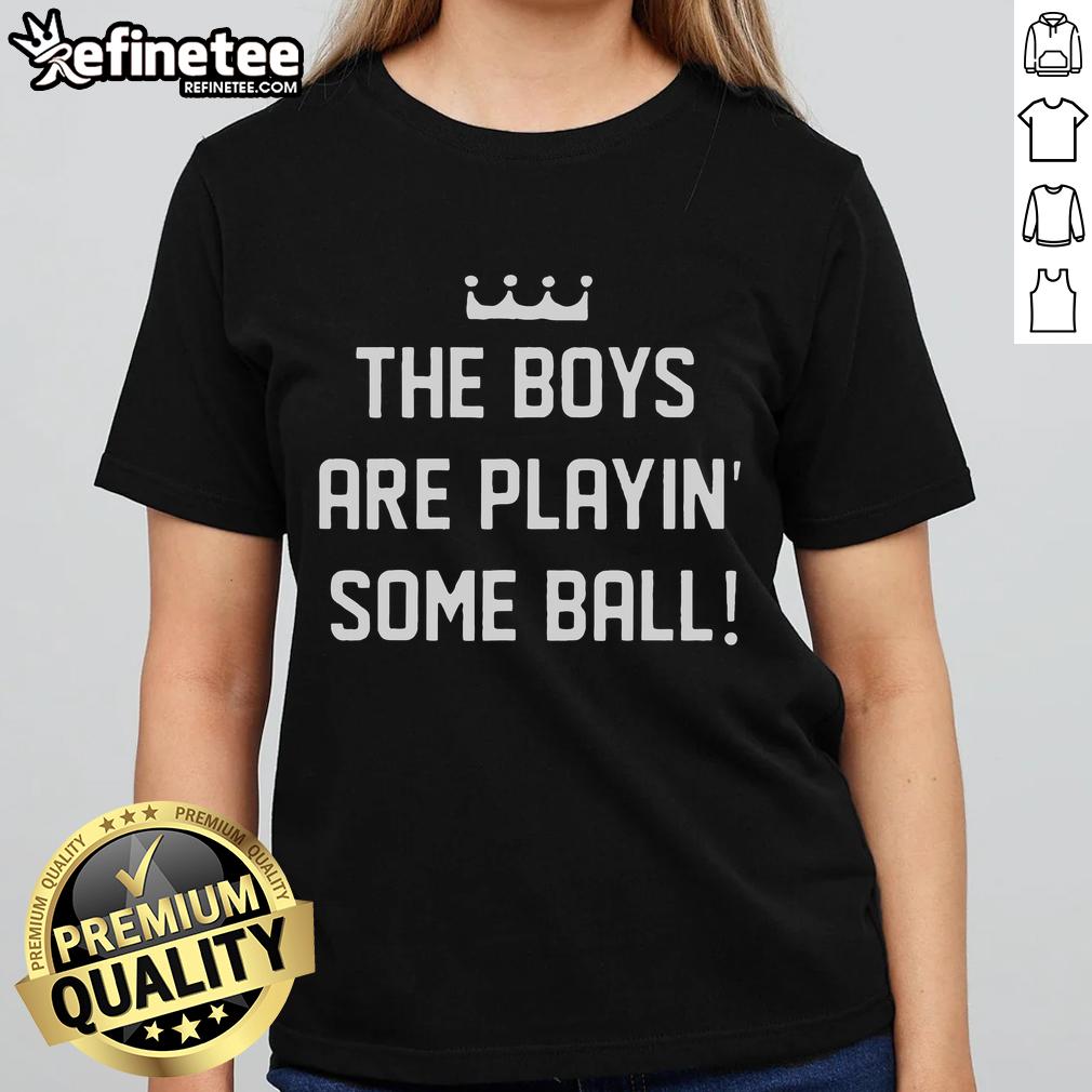 Nice the boy playing ball in a stylish ladies tee, showcasing fun outdoor activity and casual fashion for women.