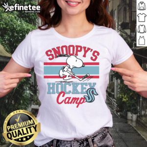 Cute Snoopy in Seattle Kraken gear at Snoopy's Hockey Camp, featuring NHL teams on a ladies tee shirt.