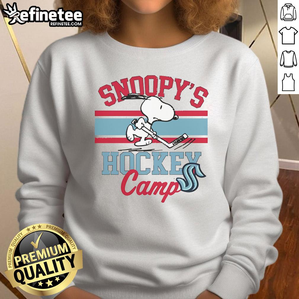 Alt Text: Cute Snoopy in a Seattle Kraken sweatshirt at Snoopy's Hockey Camp, celebrating NHL teams with playful charm.