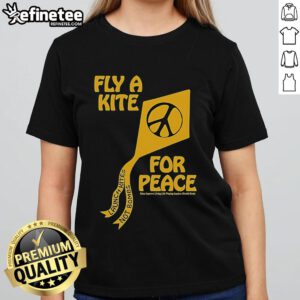 Women enjoying a sunny day flying colorful kites for peace, promoting 'Kites Not Bombs' message on a vibrant tee.