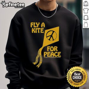 Colorful kites flying in the sky with the phrase 'Kites Improve Living' on a sweatshirt promoting peace and joy.
