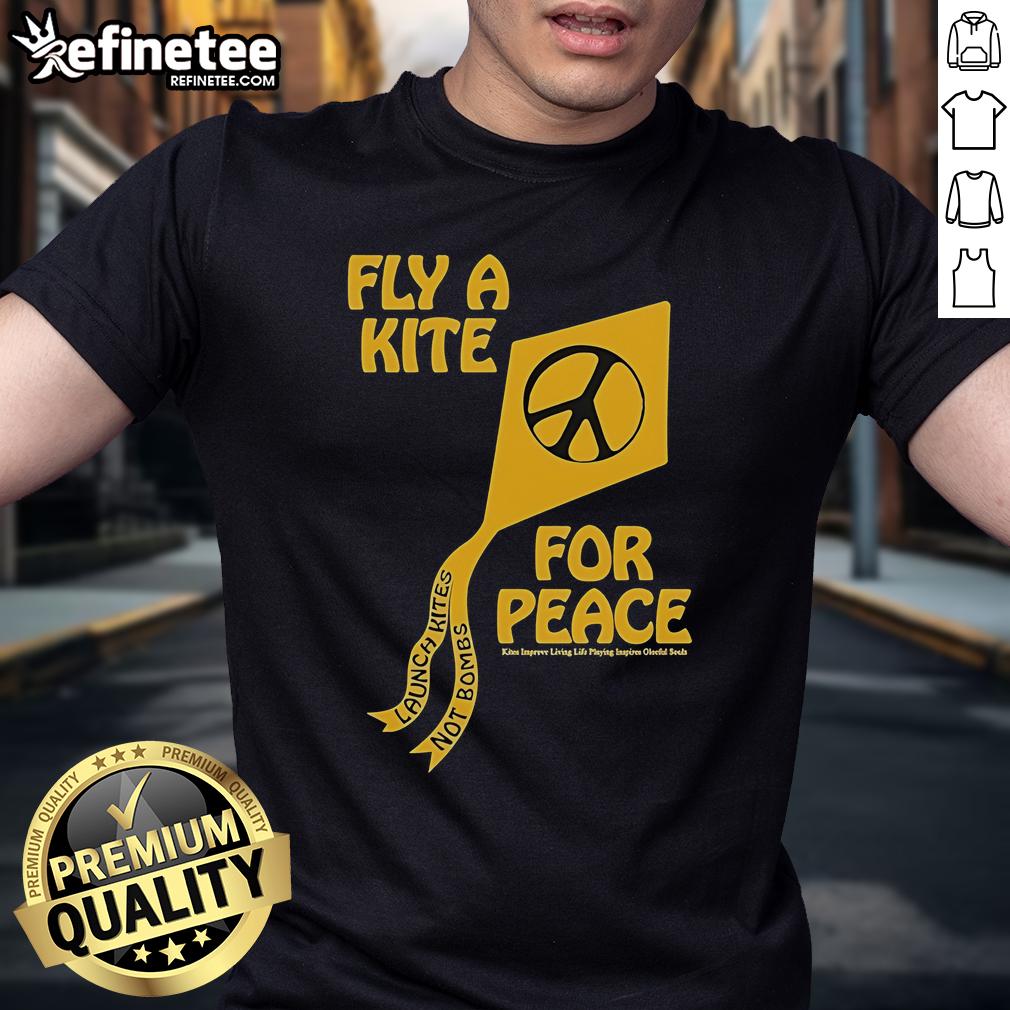 Colorful t-shirt featuring 'Kites Not Bombs' slogan, promoting peace and joy through flying kites for a better life.
