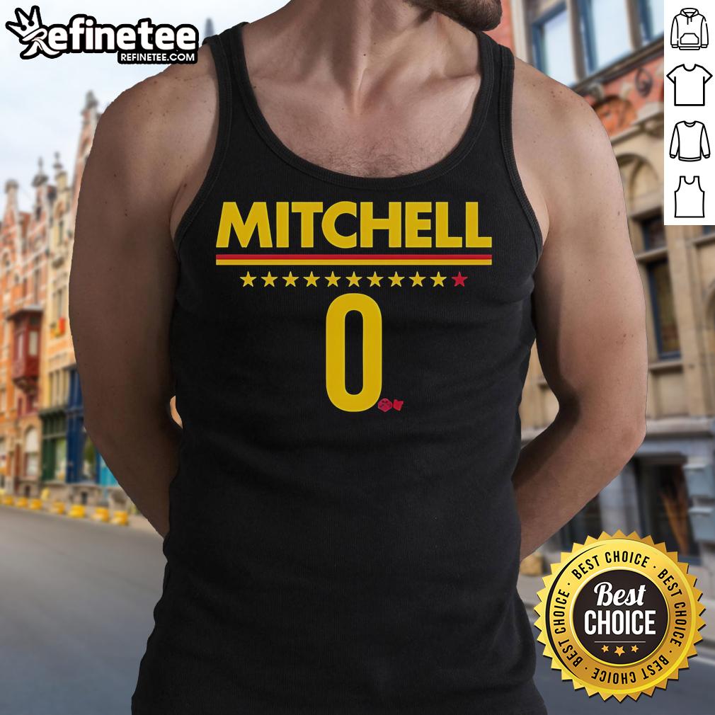 Alt Text: Kelsey Mitchell of the Indiana Fever wearing a stylish tank top during a game, showcasing her athleticism and team spirit.