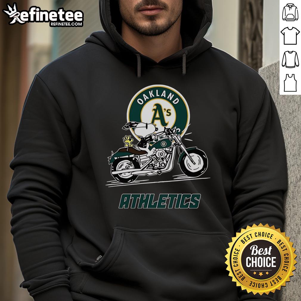 Snoopy and Woodstock riding a motorbike, wearing an Oakland Athletics hoodie, capturing a fun and playful moment.