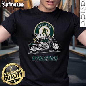 Alt Text: Cute Snoopy and Woodstock on a motorbike graphic on Oakland Athletics T-shirt, perfect for fans and casual wear.