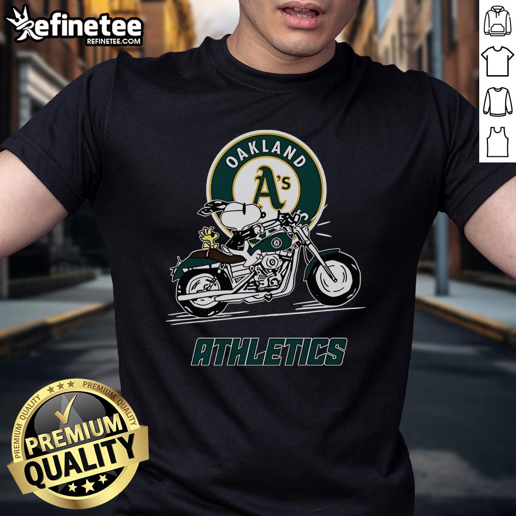 Alt Text: Cute Snoopy and Woodstock on a motorbike graphic on Oakland Athletics T-shirt, perfect for fans and casual wear.