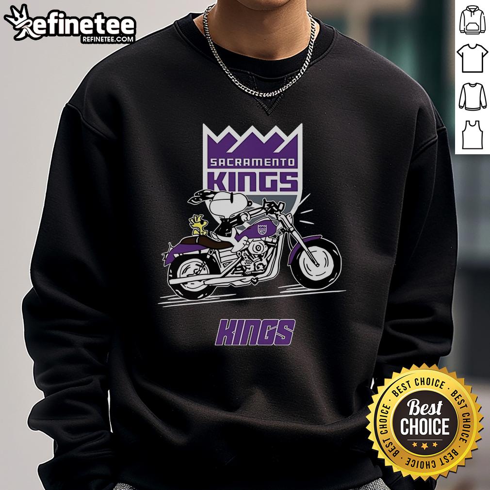 Snoopy and Woodstock riding a motorbike in a Sacramento Kings sweatshirt, showcasing a fun and stylish design.