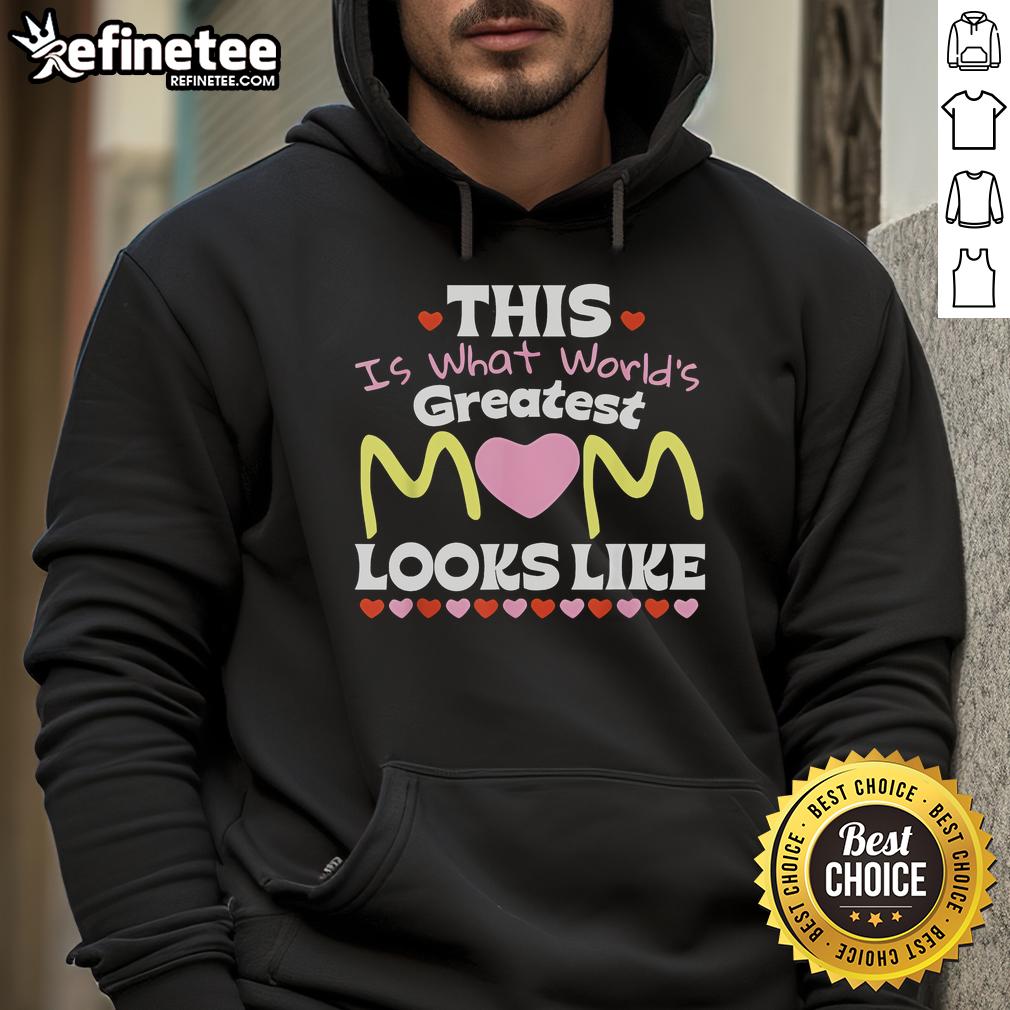 Mom wearing a 'World's Greatest Mom' hoodie, smiling for Mother's Day in a cozy setting.