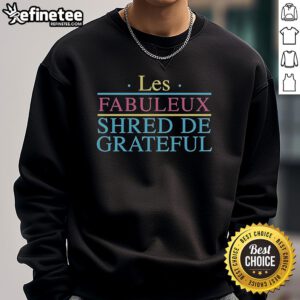 Alt Text: Official Grateful Shred Les Fabuleux Shred de Grateful sweatshirt displayed on a wooden background.