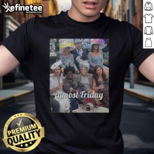 Alt Text: Official Kodak Derby Almost Friday T-Shirt featuring a vibrant graphic design perfect for casual wear and Derby events.