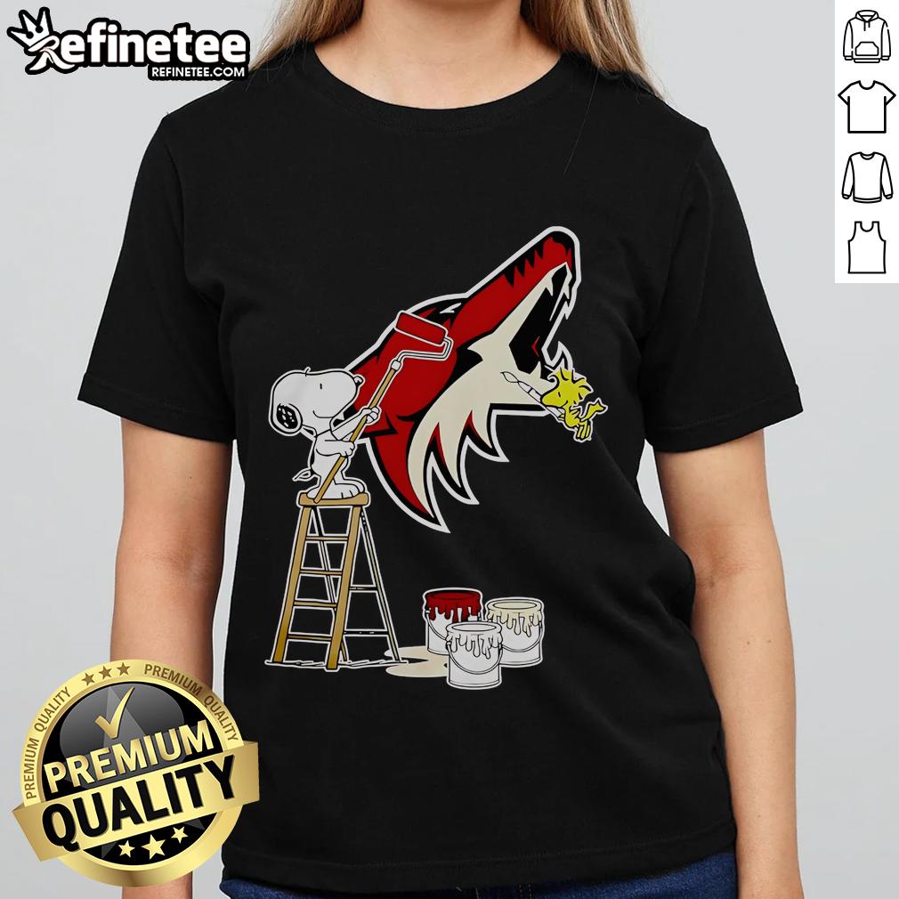 Alt Text: Official Snoopy and Woodstock painting on Arizona Coyotes logo ladies tee shirt, perfect for fans and collectors.