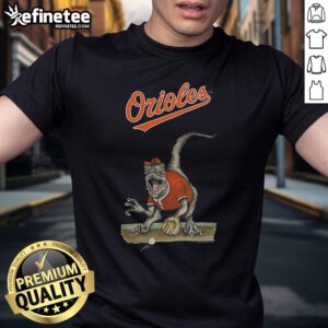 Alt Text: Official Baltimore Orioles Tiny Turnip Velociraptor T-Shirt featuring a fun dinosaur design for young fans.